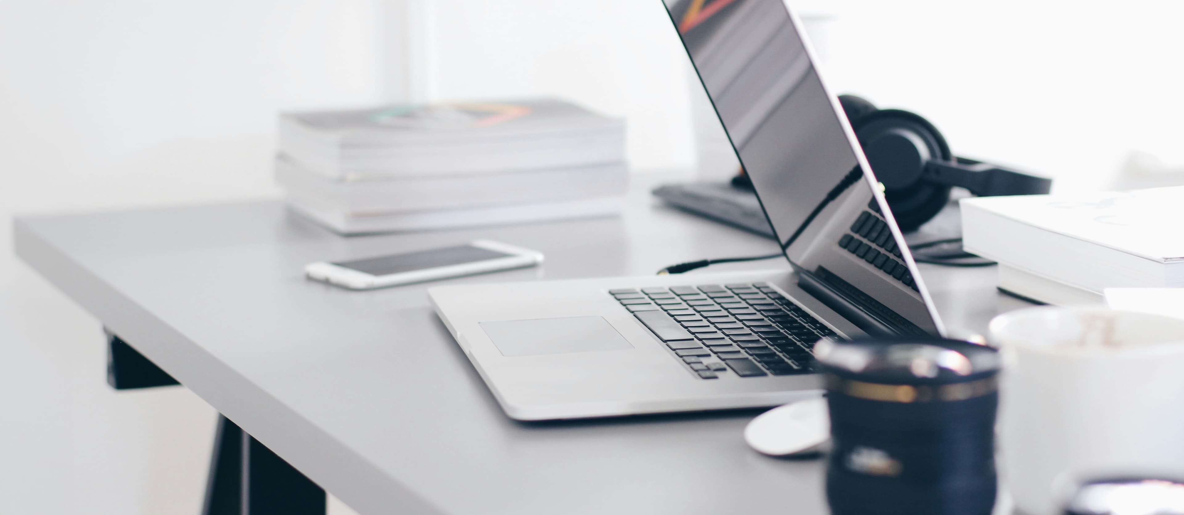 Desk with a laptop and notebook